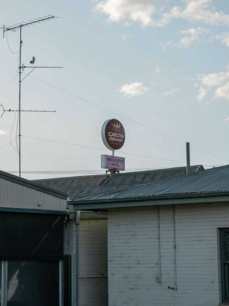 The Carlton Draught sign and outbuildings at the Macalister Hotel in Maffra, Victoria.